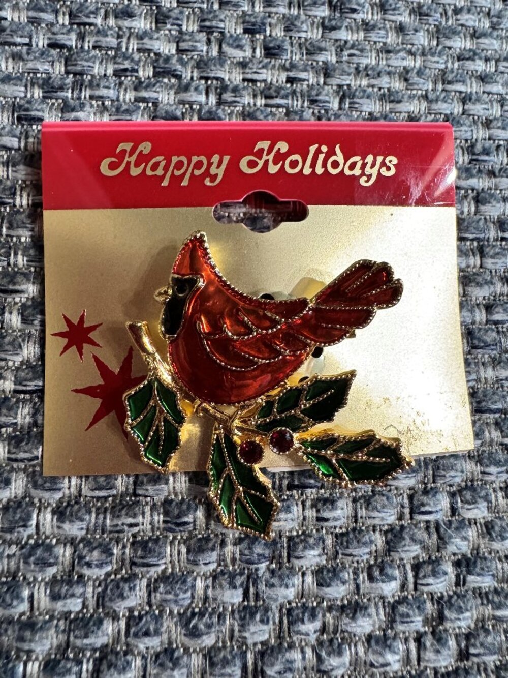 Festive gold-tone cardinal brooch